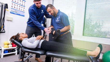 Doctor of Chiropractic students working in a clincal setting